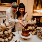 Bride and groom cut wedding cake at Hill Physick House